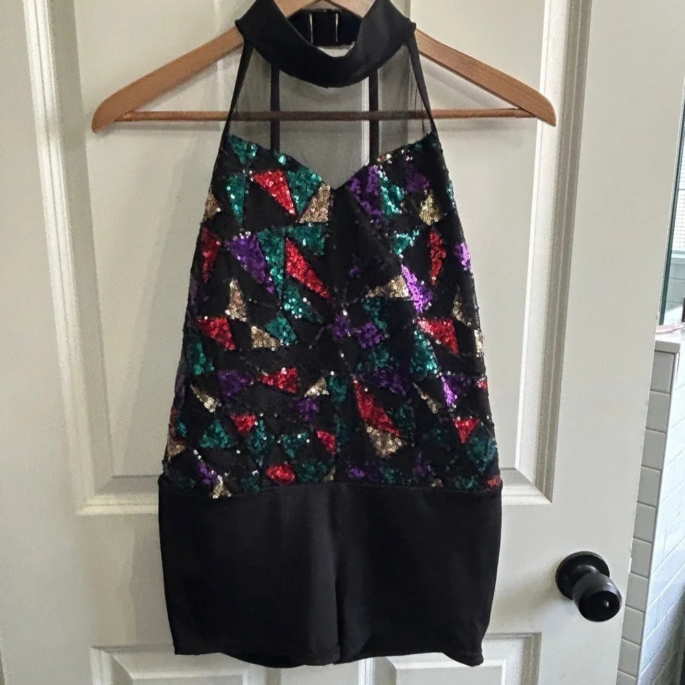 Like new XL girl’s 3 piece dance costume. Halter  leotard with  short & 2 skirts